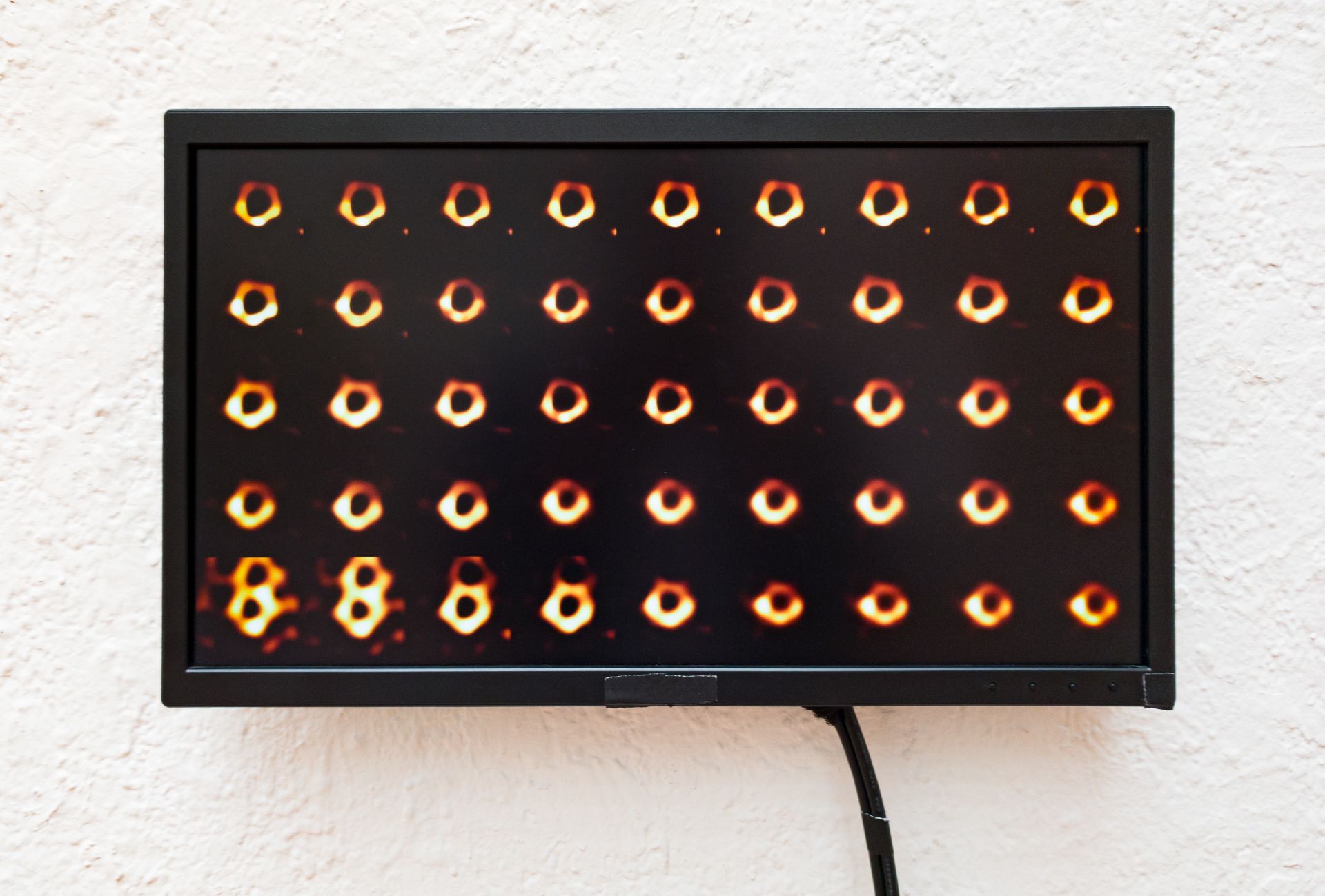 Monitor displaying the generative video piece.